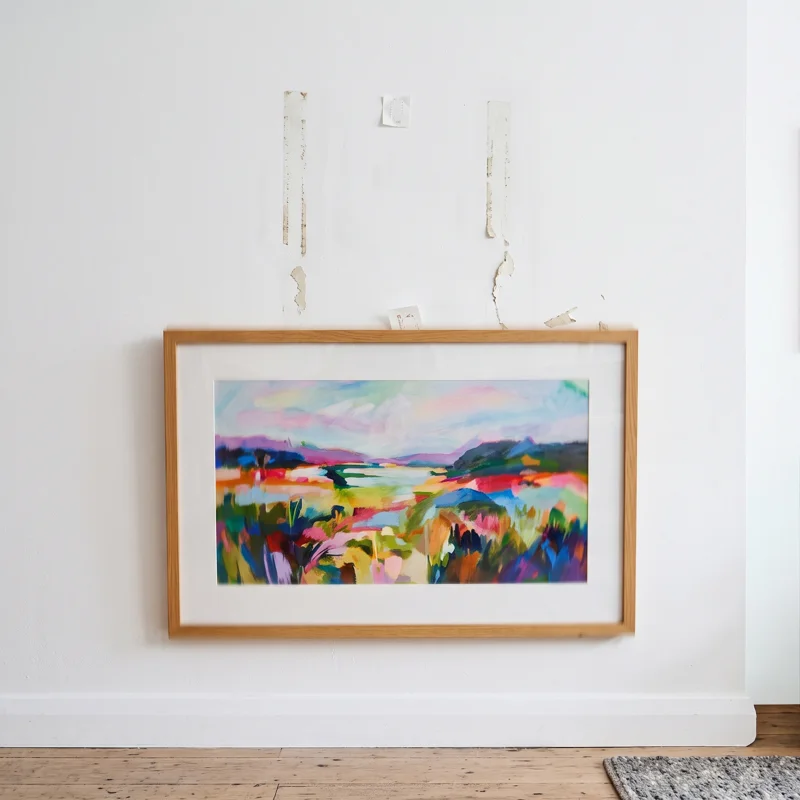 An image of a large watercolour painting falling off a wall